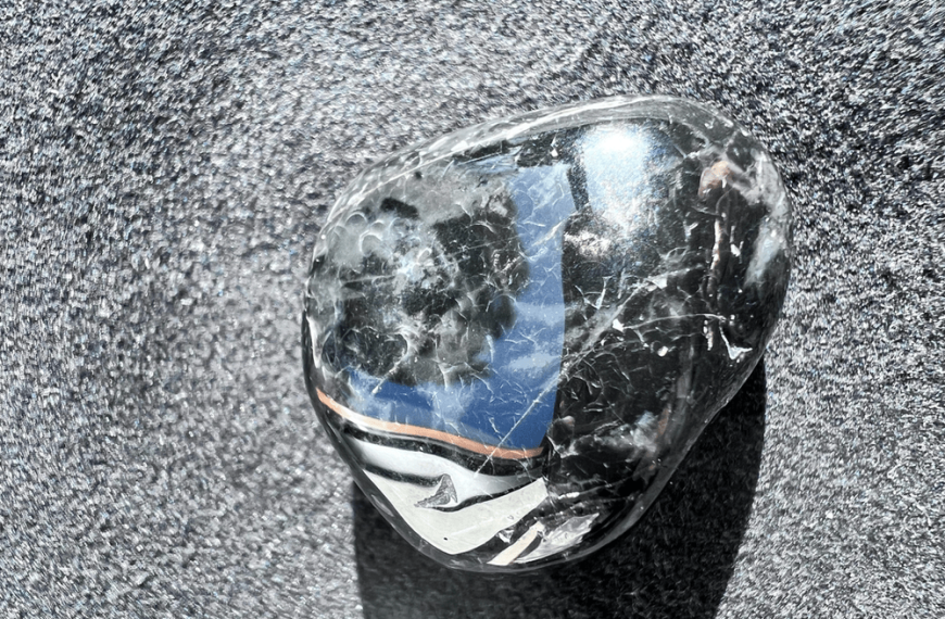 onyx black stone on a neutral background to illustrate onyx