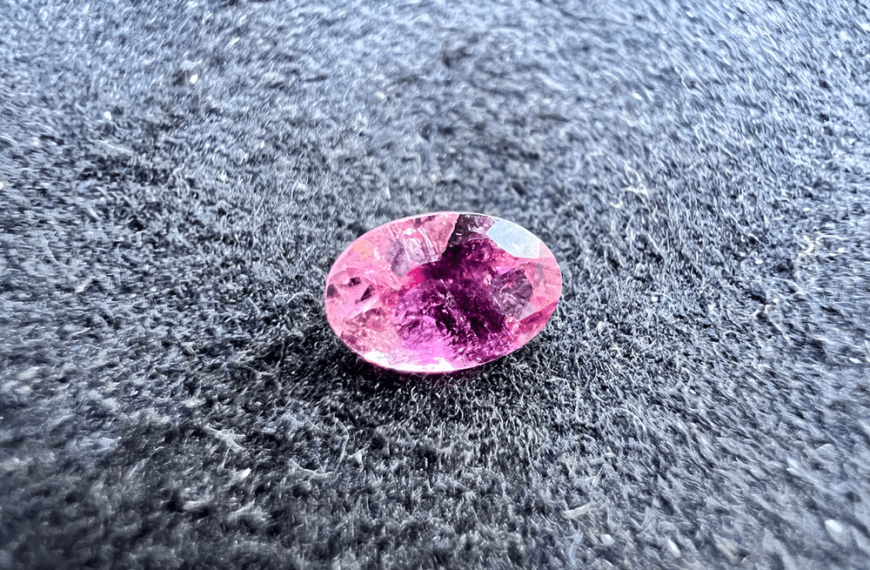 malaya or malaia garnet pink stone on neutral background to illustrate a pink stone