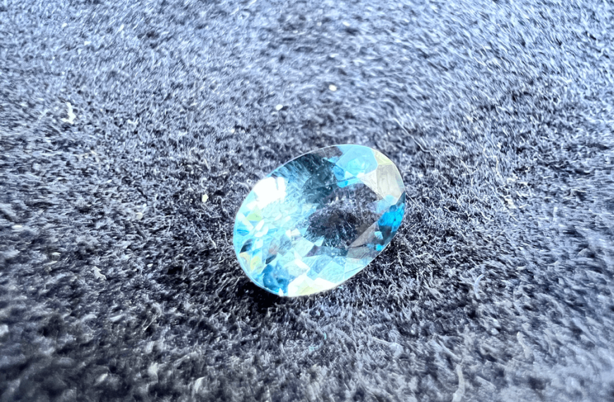 sky-blue aquamarine cut on a neutral background to illustrate a blue gemstone