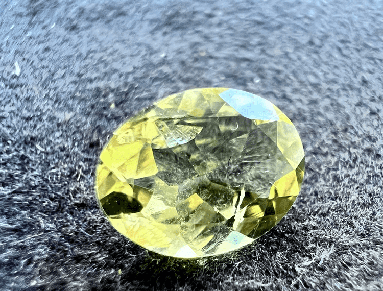 natural yellow heliodore stone cut to illustrate heliodore as a yellow gemstone