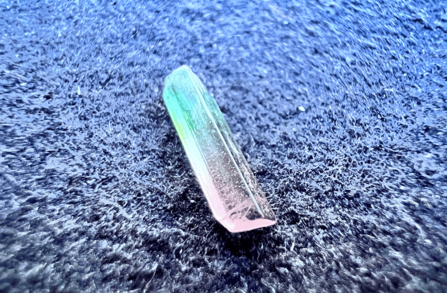 green and pink rough watermelon tourmaline to illustrate a green gemstone